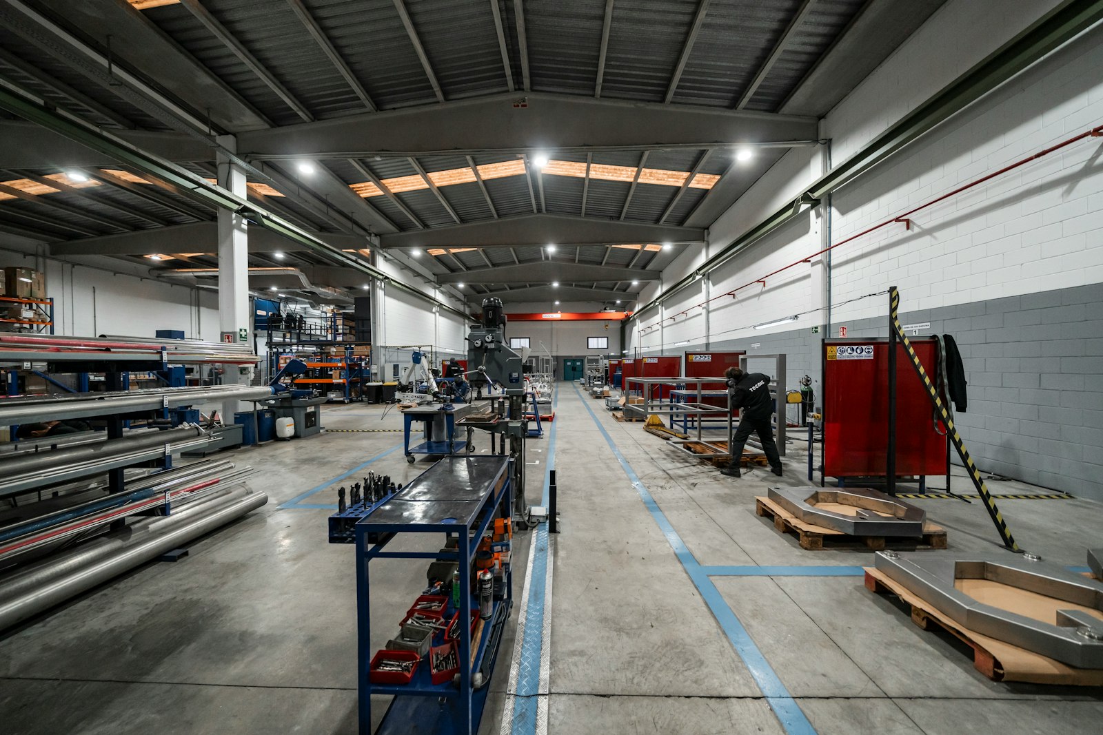 Modern manufacturing floor with workers and production equipment